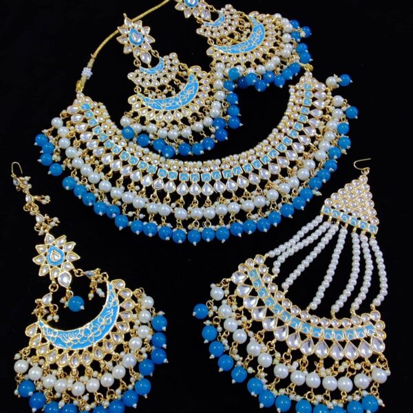 Emerald Kundan Choker Jewellery Set With Beautiful Tikka Paisa Earings This complete set is made of Alloy and the top is Gold Plated. White and Dark Iris Blue Beads Hanging