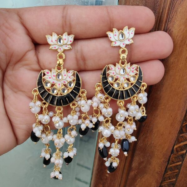 Lightweight meenakari and long pearl earrings made of alloy gold plated. From artificial stone and black pearl