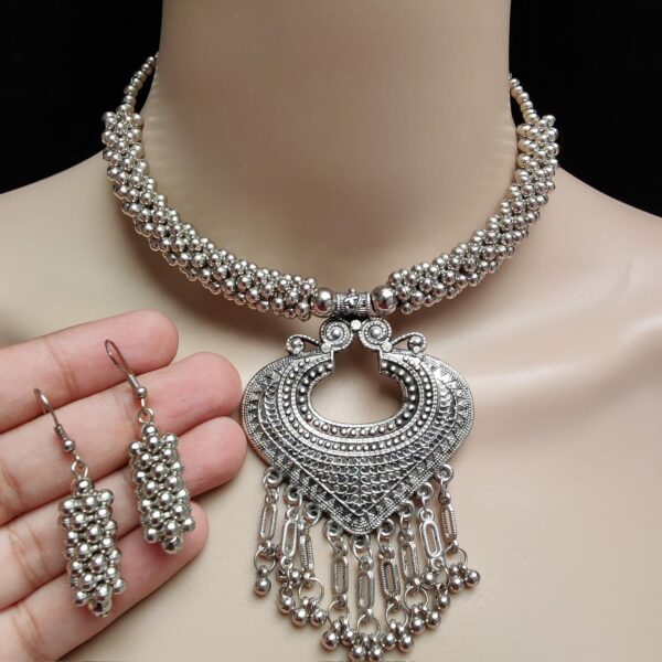 Beautifully Premium Quality Oxidised Silver Necklace With Earings, who is made Metal Alloy on which Plating Oxidised Silver .Artificial stones and pearls are used to make it more beautiful.