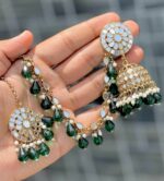 British green earrings with beautiful tika made of kundan beads and the material is alloy
