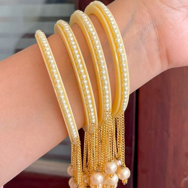 golden colour latkan bangle with beautiful golden pearls