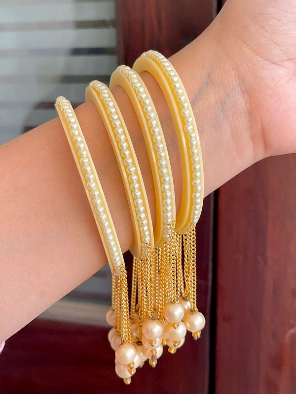 golden colour latkan bangle with beautiful golden pearls